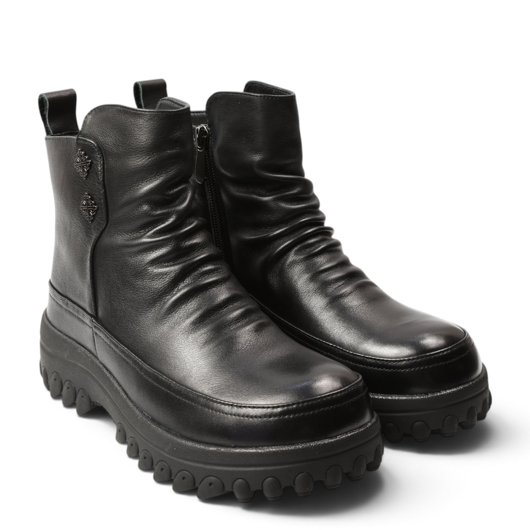 ada-shoes.ro black leather ankle boots with front pleats, thick lug sole, and side zipper for casual-chic style.
