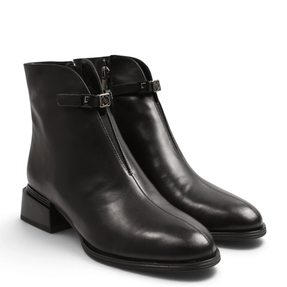 ada-shoes.ro black leather ankle boots with geometric block heel, side zipper, and decorative metallic strap detail.