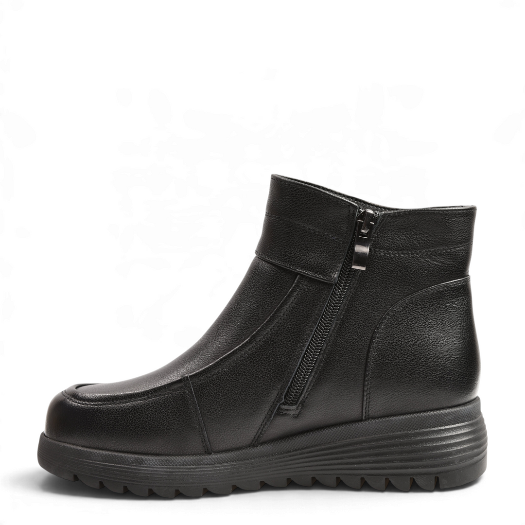 ada-shoes.ro Anna Viotti black leather ankle boots with side zipper, moccasin-style stitching, and thick lug sole.