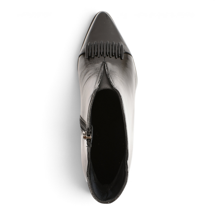 Top view of black patent leather Epica ankle boots with a square toe and linear ornamental detail on the vamp.