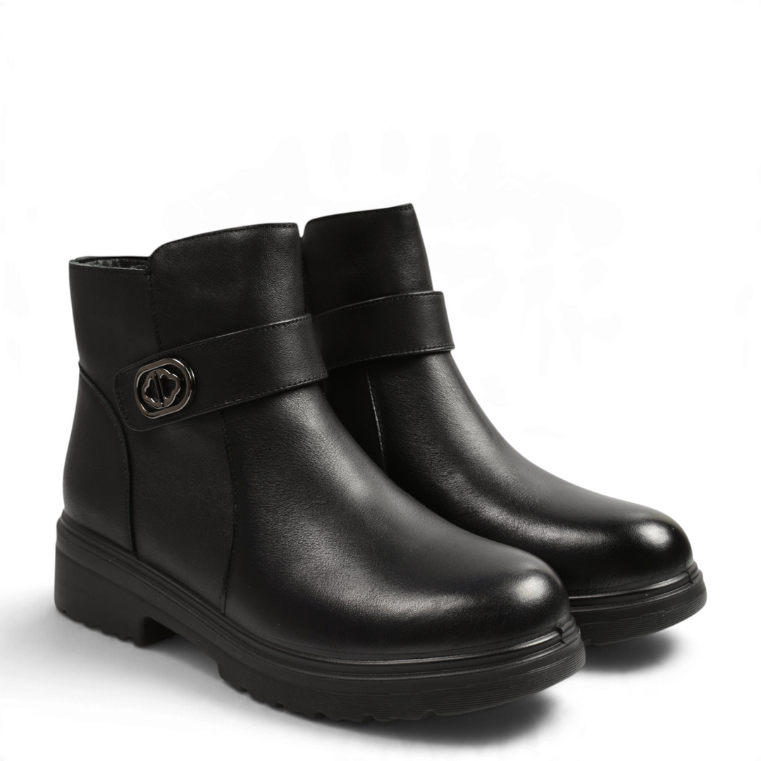ada-shoes.ro black leather ankle boots with a decorative strap, oval metal buckle, and thick lug sole for women.