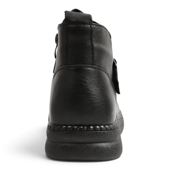 Back view of black leather Ada Shoes 97305-N ankle boots with a thick, textured sole and rear pull tab