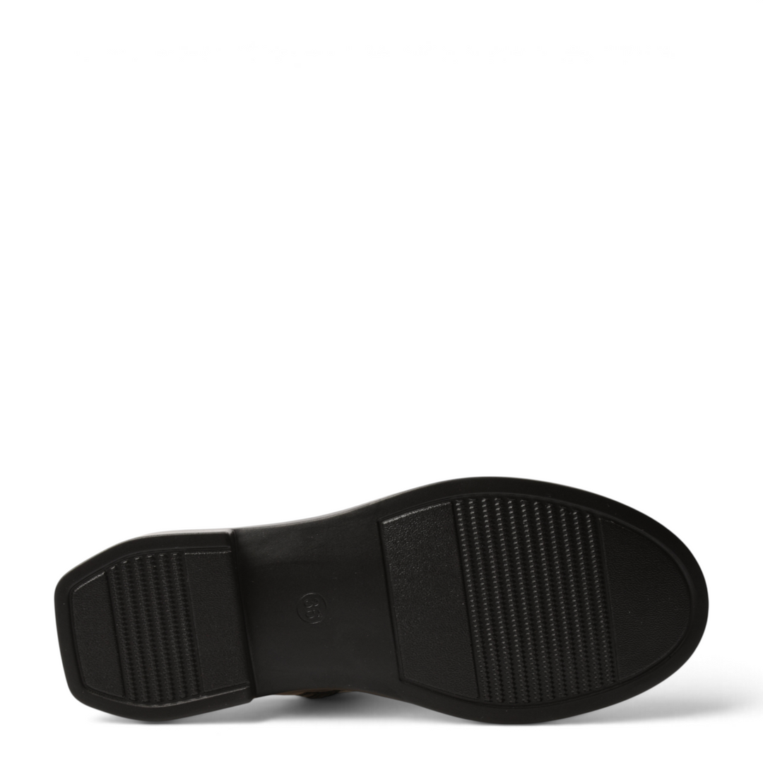 Black rubber sole of a Pass Collection ankle boot with a textured anti-slip tread pattern on a white background