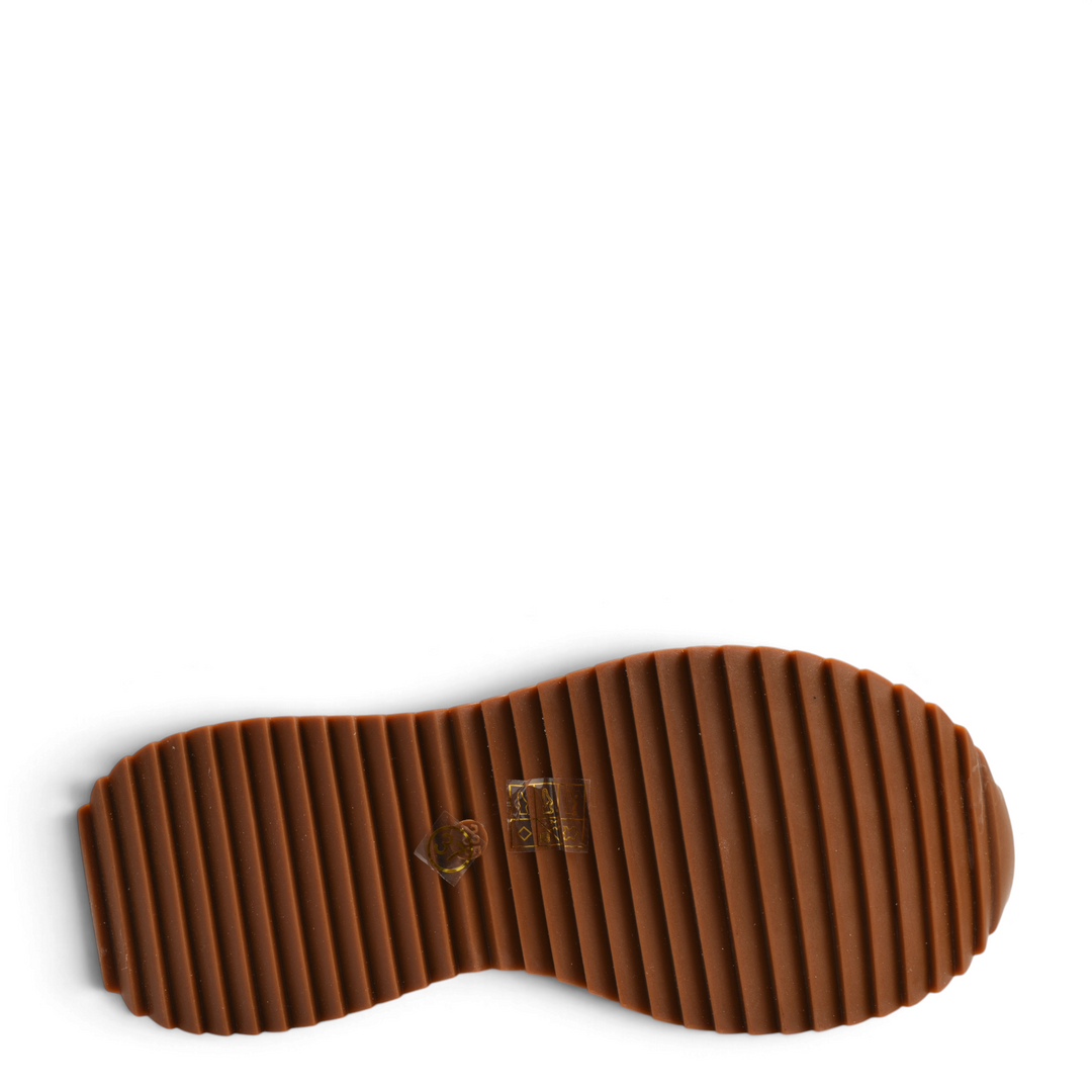 Brown rubber lug sole of Ada Shoes 66H-R boots showing the textured tread pattern for grip