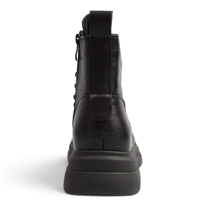 Back view of ada-shoes.ro black leather combat boots with a thick lug sole and a pull tab on a white background