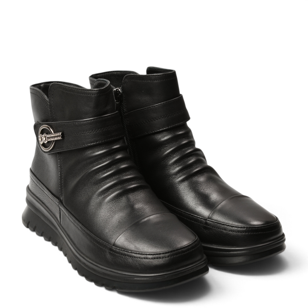 ada-shoes.ro black leather ankle boots with decorative side buckle, pleated front detail, and comfortable flat sole.