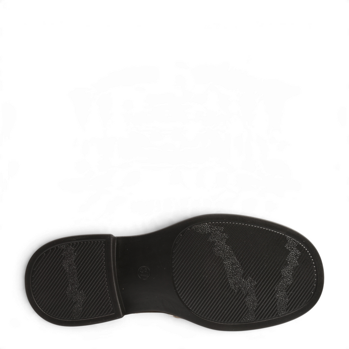 Black rubber sole of an Anna Viotti loafer with a textured grip pattern and small block heel