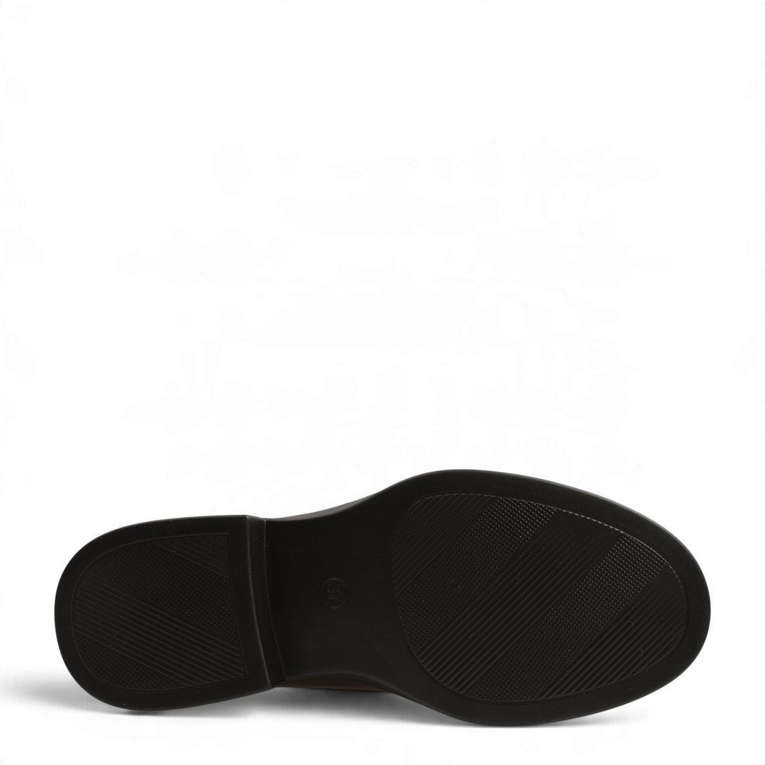 Black rubber sole of an Anna Viotti loafer showing textured grip patterns and a small heel for stability
