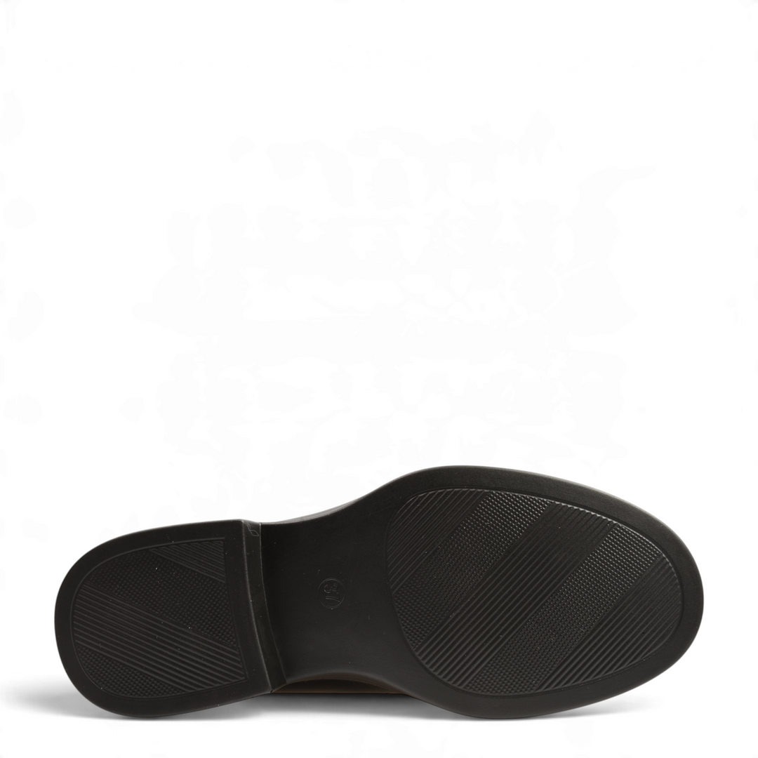 Black sole of Anna Viotti loafers showing the textured, non-slip tread pattern and low heel design.
