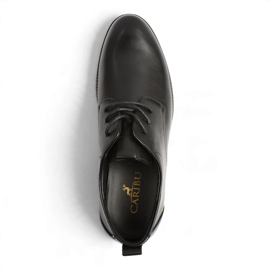 Top view of black leather Otter Derby shoes with laces and Caribu branding on the insole