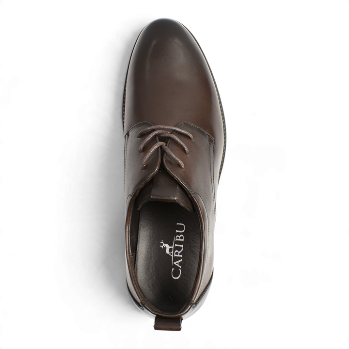 Top view of brown leather Otter Derby shoes with laces and Caribu branding on the insole