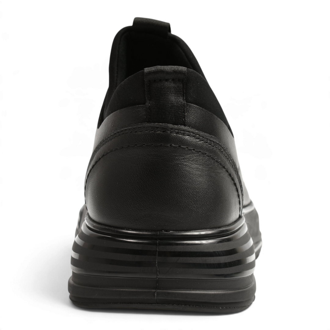 Back view of black leather Otter casual shoes with a thick, striped sole and elastic collar from ada-shoes.ro