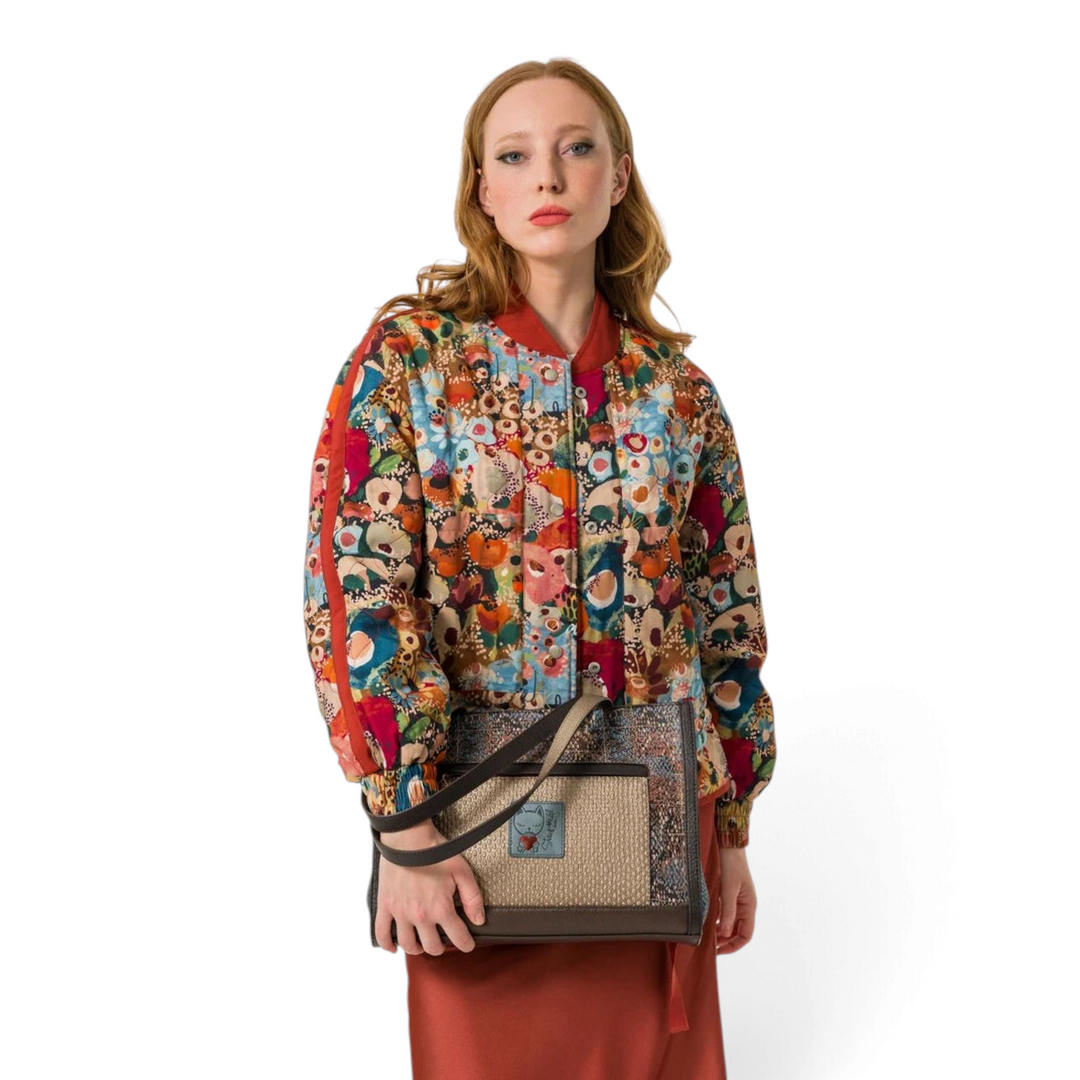 ada-shoes.ro Anekke Bloom shopper bag in beige and brown faux leather with artistic print, held by a model.