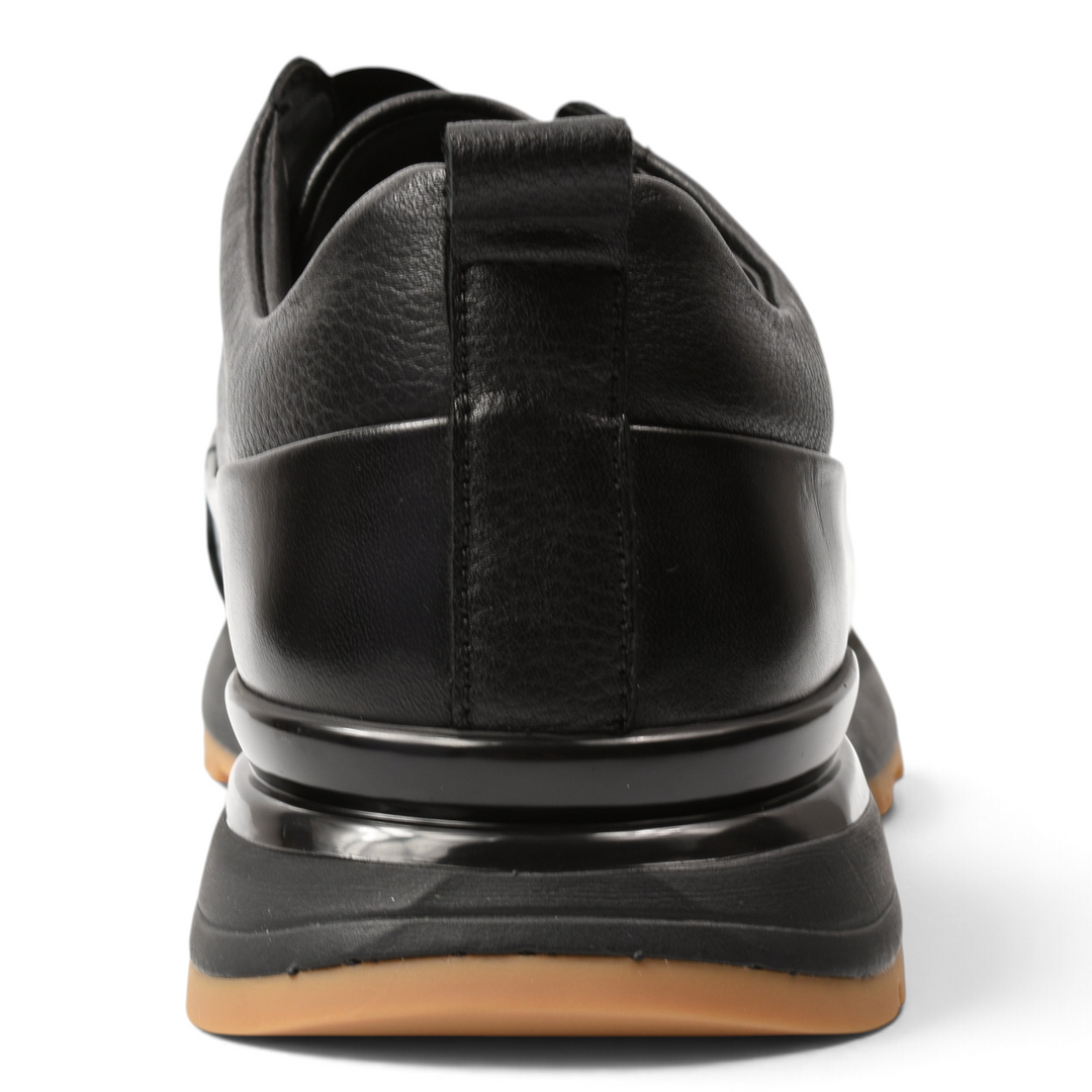 ada-shoes.ro black leather sneakers with a pull tab and a gum-colored rubber sole, viewed from the back.